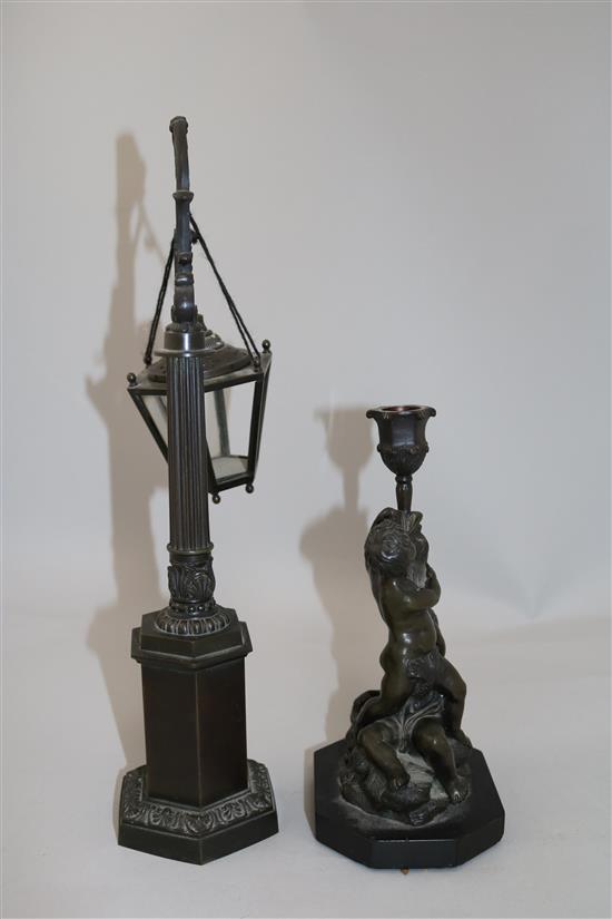 A bronze candlestick & a miniature lantern